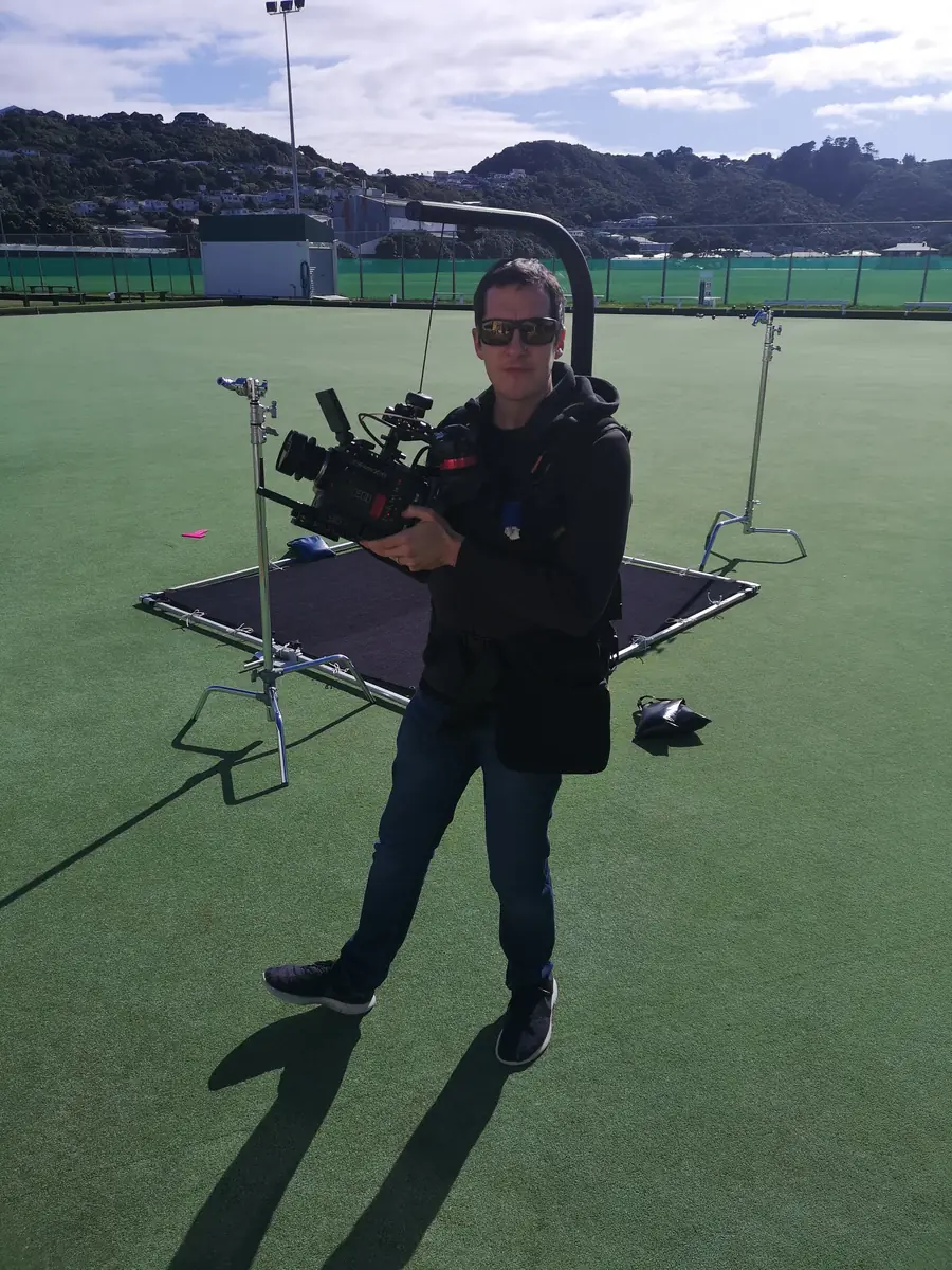 Ro Tierney with a RED cinema camera on set in Wellington